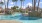 a pool with trees around it