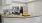 a kitchen with white cabinets