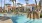 a pool with a building in the background
