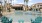 a pool with chairs around it