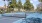 a tennis court with trees and buildings