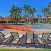 lounge chairs surround outdoor pool