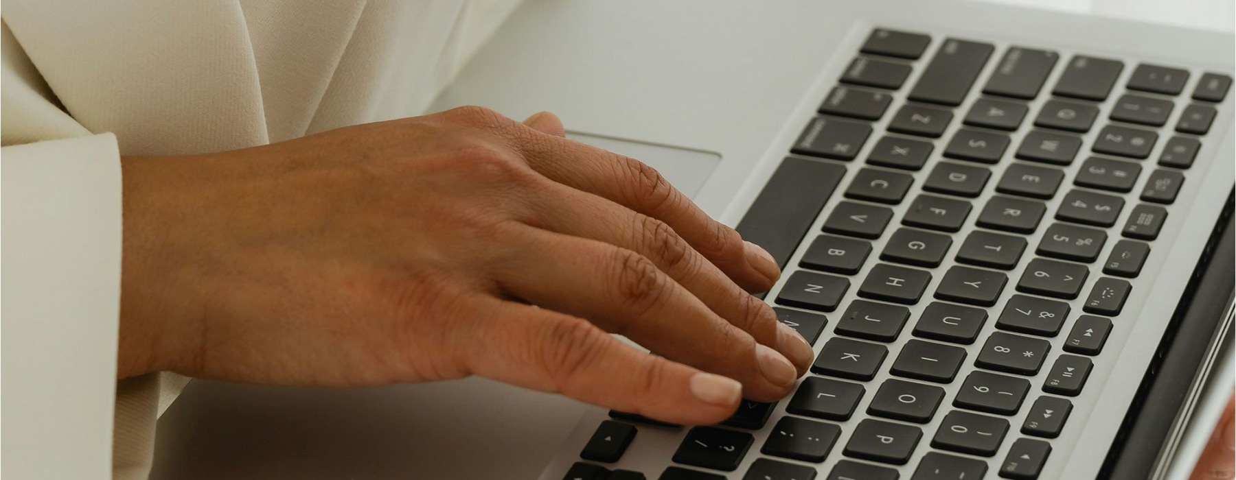 a person typing on a laptop