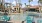 a pool with chairs around it